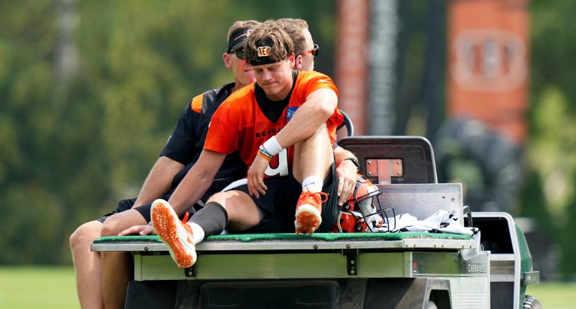 Cincinnati Bengals quarterback Joe Burrow (9) is carted off the field after an injury on a scramble play during NFL football training camp, Thursday, July 27, 2023, in Cincinnati.